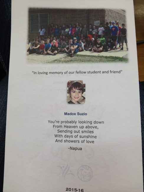 The back of the program. Top is of all the graduating kids, with one student holding a photo of Madox 